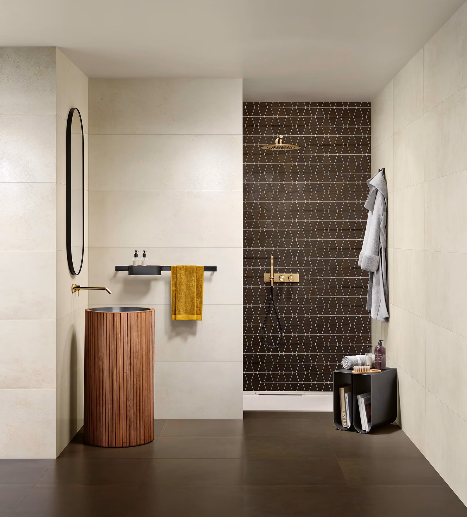 Modern bathroom with wood cylindrical sink, yellow towel, black geometric tiled shower wall, and a gray robe.