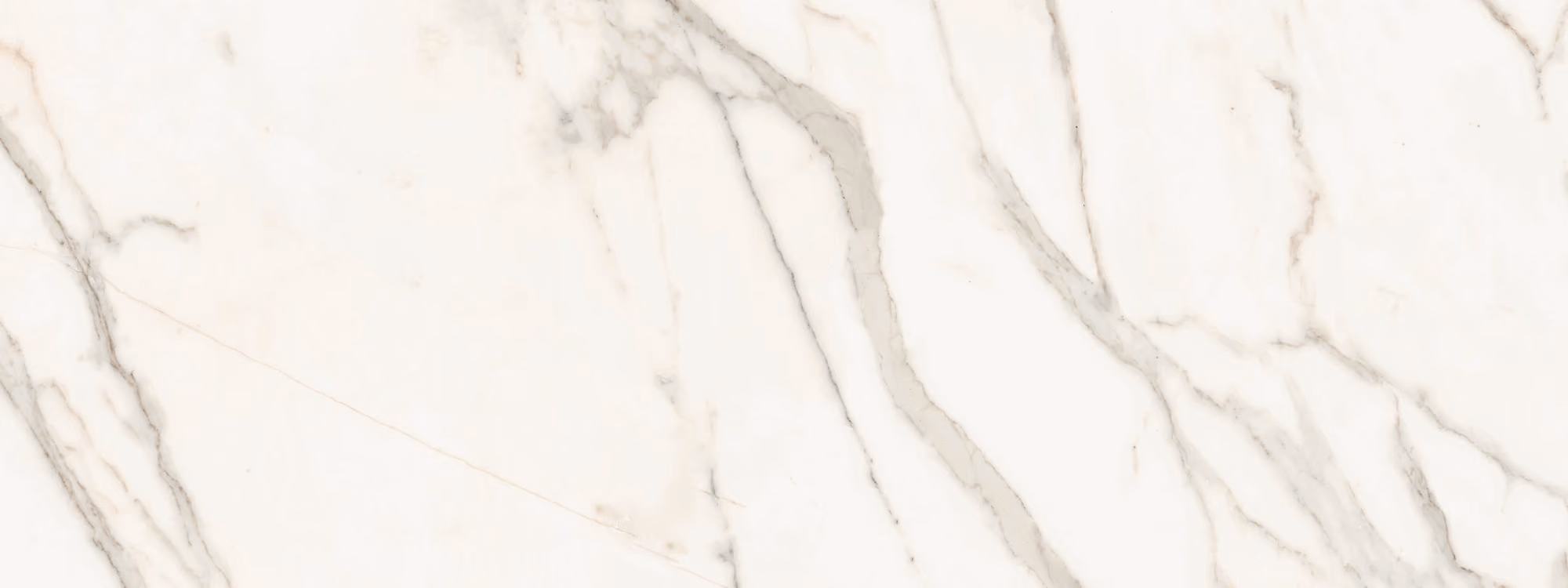 White marble surface with light gray veining in irregular patterns.