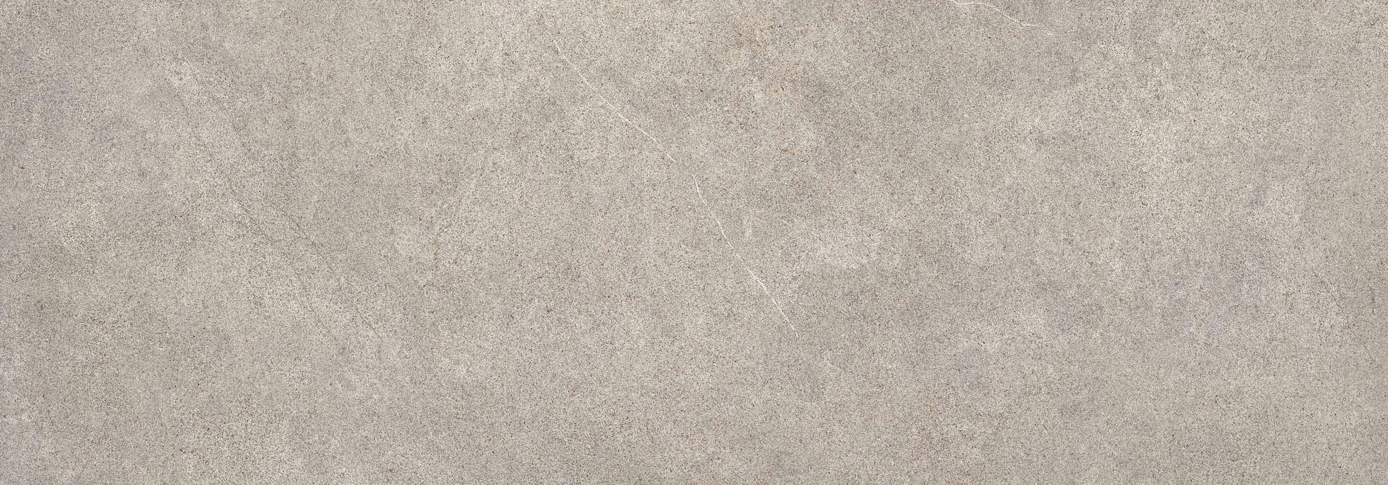 Light grey textured concrete surface with subtle cracks and small speckles.