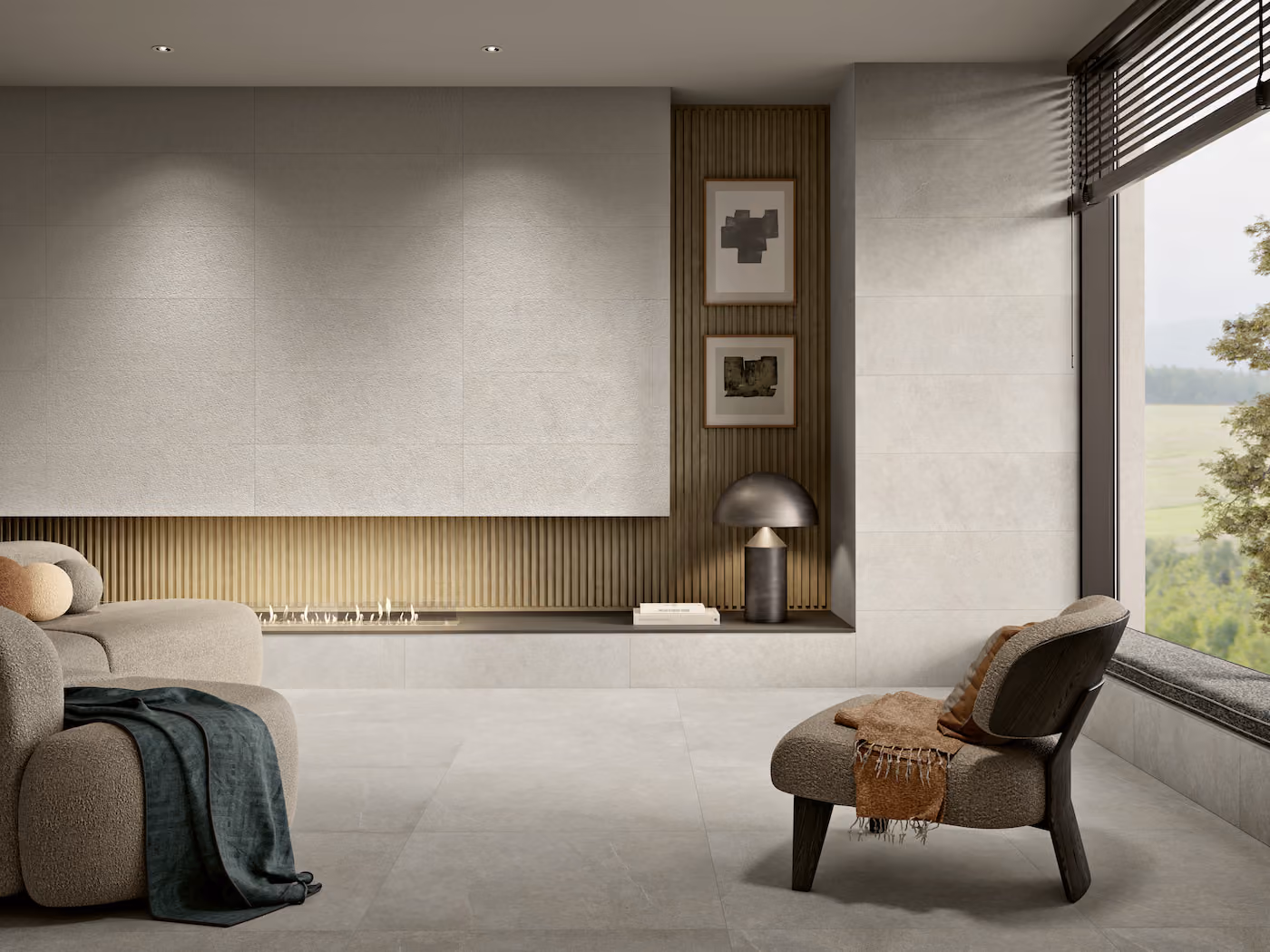 Modern living room with curved sofa, armchair, decorative pillows, fireplace, and large window with blinds.