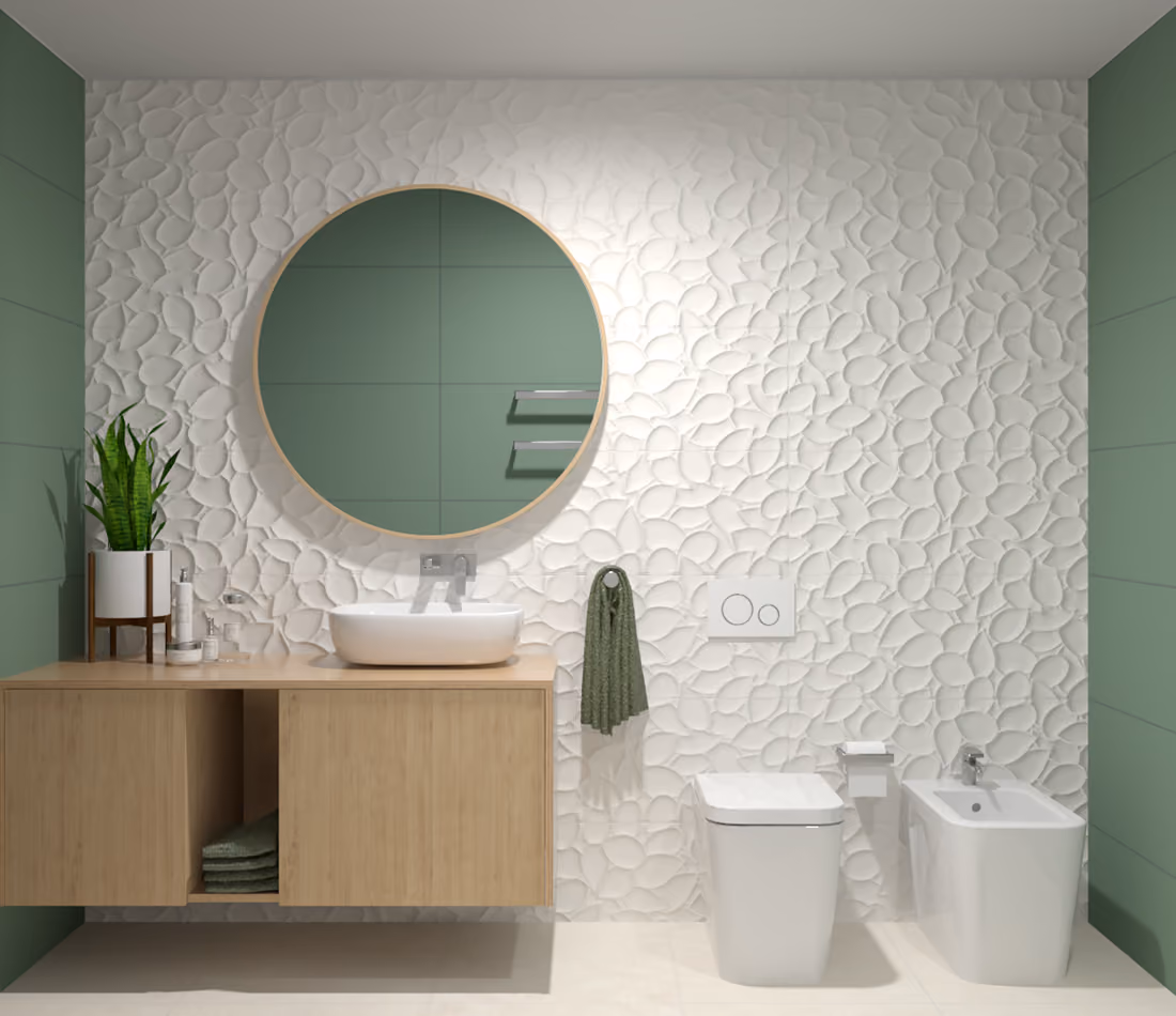Modern bathroom with leaf-patterned white wall, round mirror, wooden vanity, toilet, bidet, and green accents.