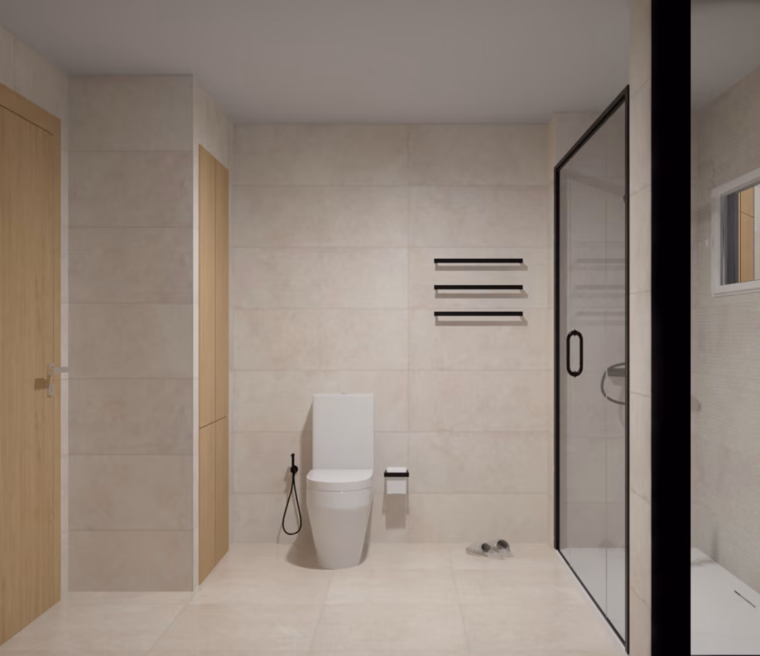 Modern bathroom with white toilet, wooden door, tiled walls, glass shower enclosure, and black fixtures.