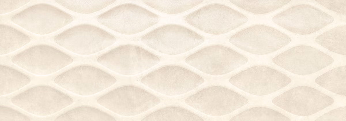 Close-up of a white textured surface with a repeating lattice pattern.