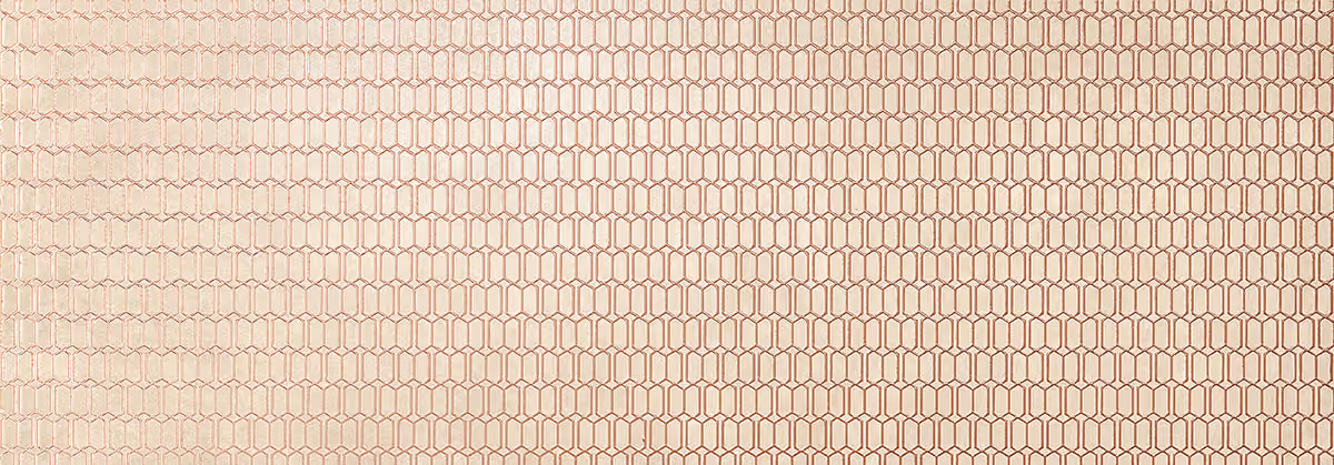 Close-up of beige surface with a repeating geometric pattern of hexagonal shapes.