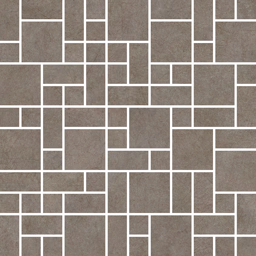 Pattern of grey rectangular and square tiles with white grout forming a mosaic design.