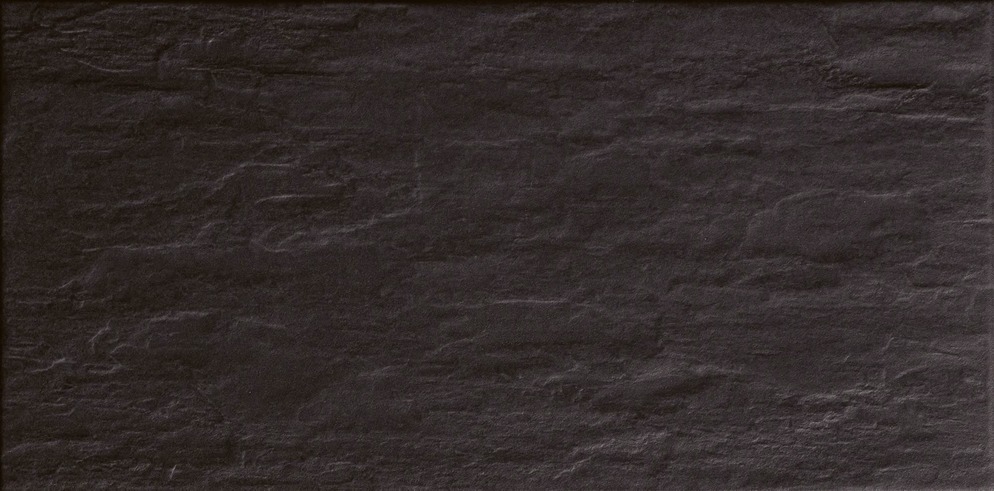 Dark black slate stone texture with natural rough surface.