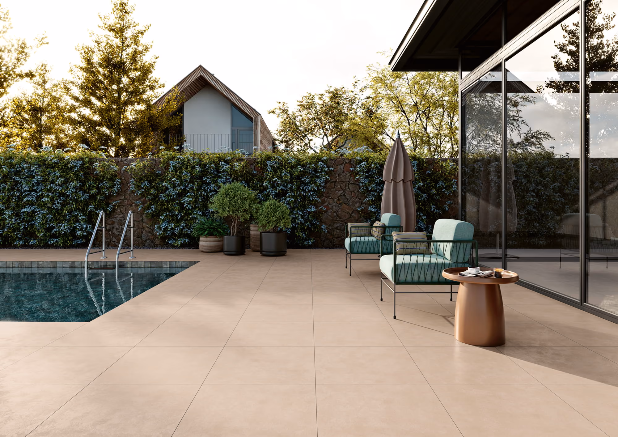 Modern patio with pool, two green chairs, a small table, potted plants, and glass wall reflection.