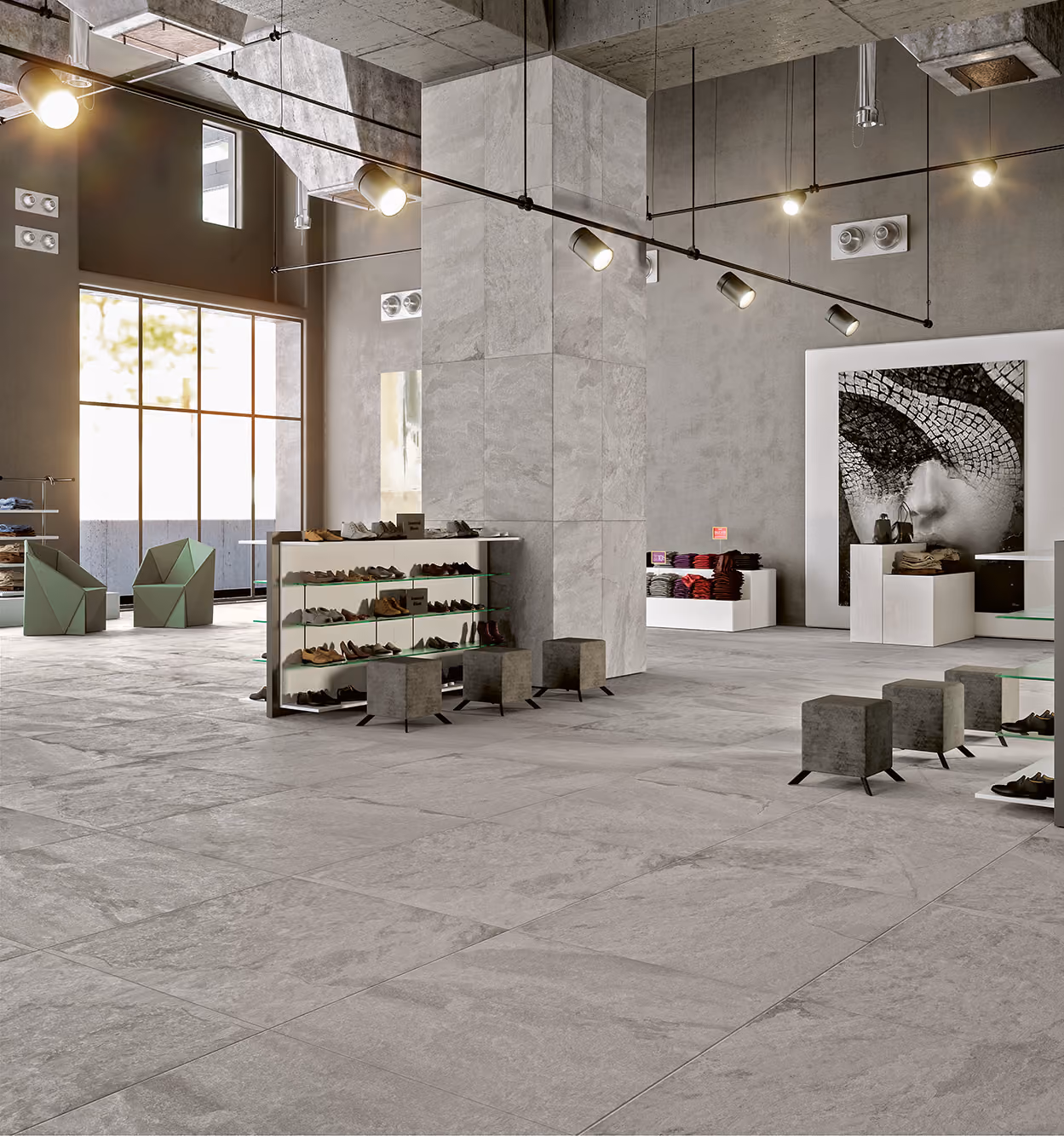 Modern shoe store interior with concrete pillars, gray floor tiles, seating, and minimalist displays.