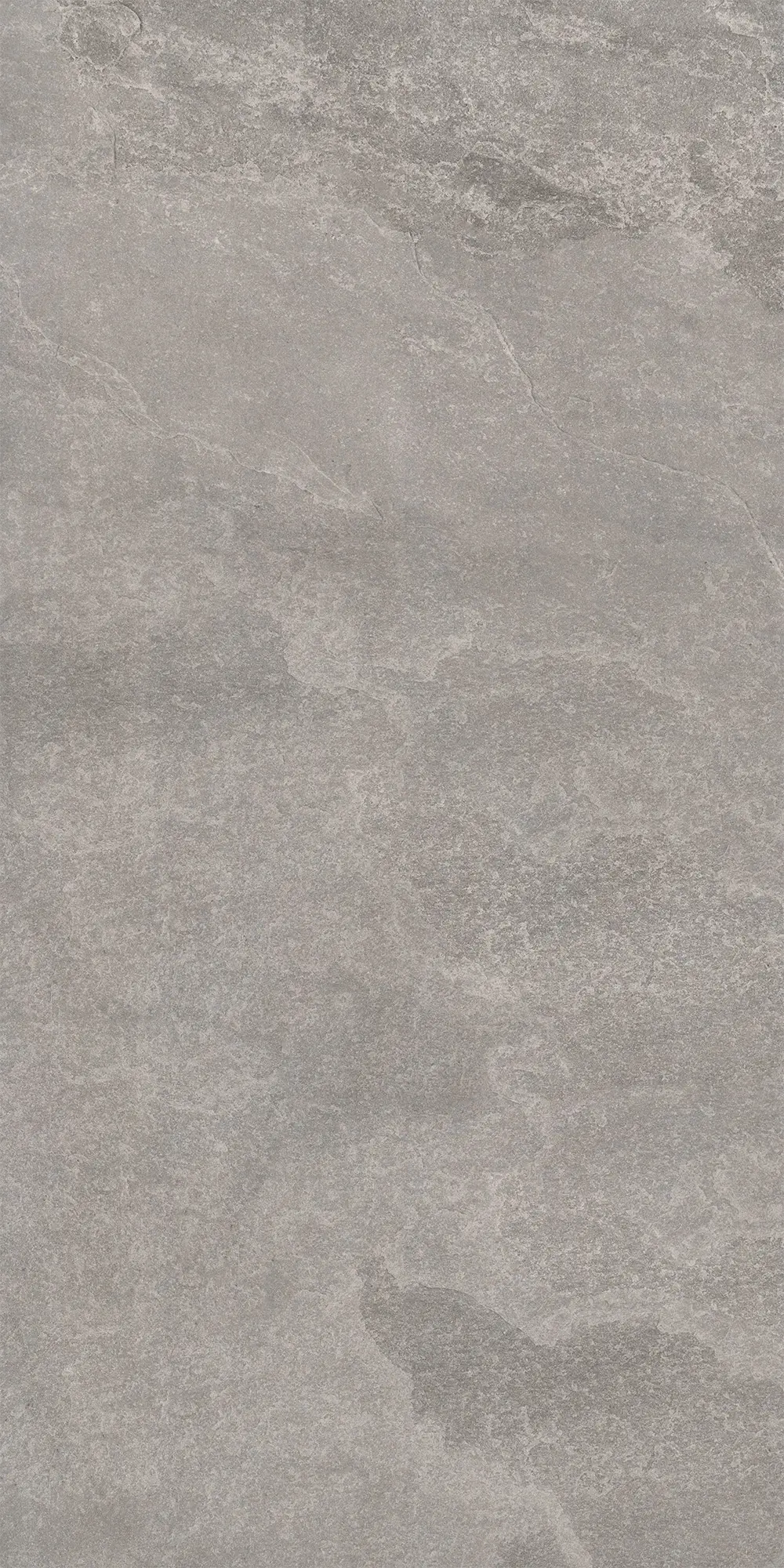 Close-up of textured gray stone surface with subtle natural patterns and cracks.