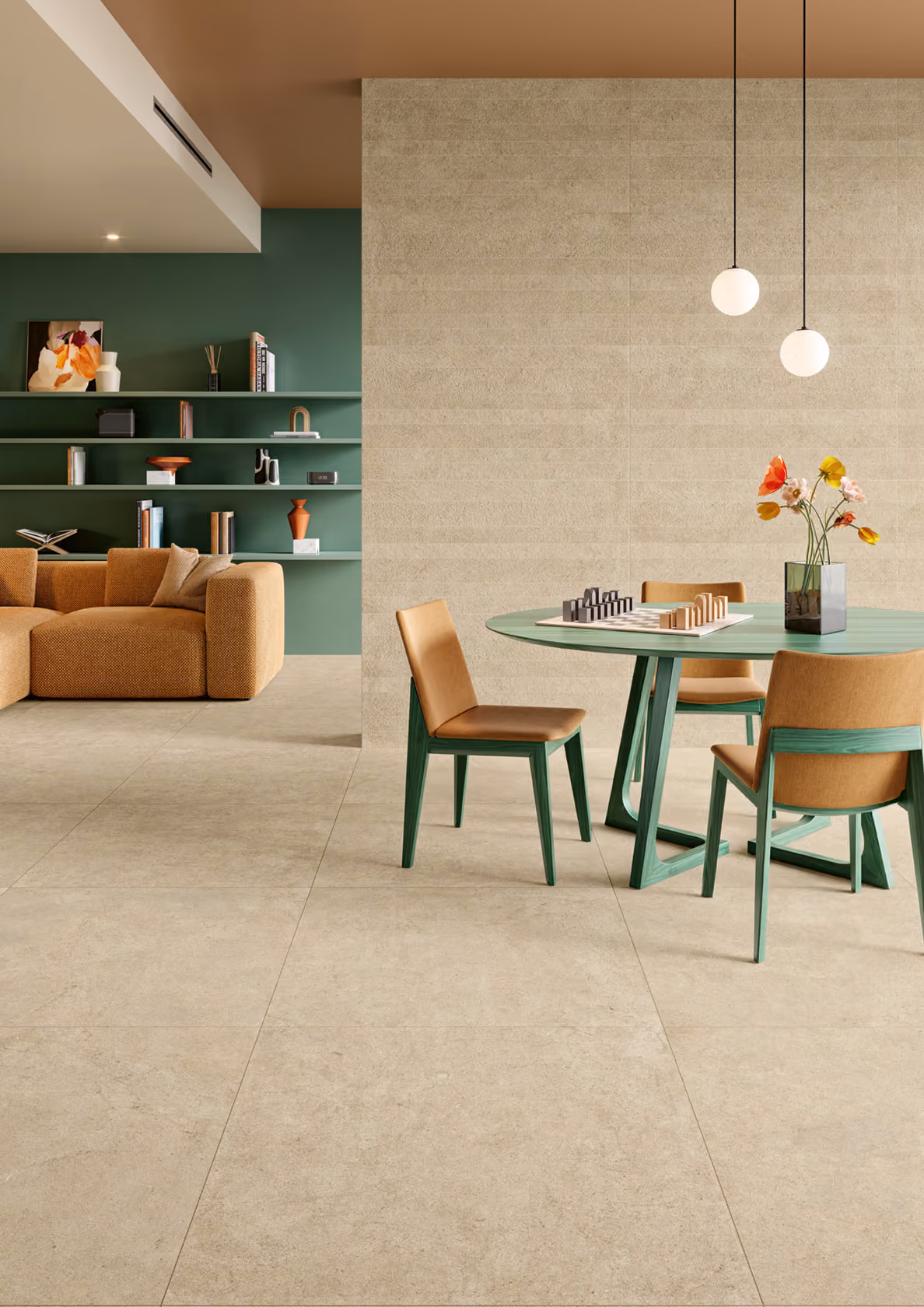 Modern living room with green wall shelves, tan sofa, round green table with chairs and hanging lights.