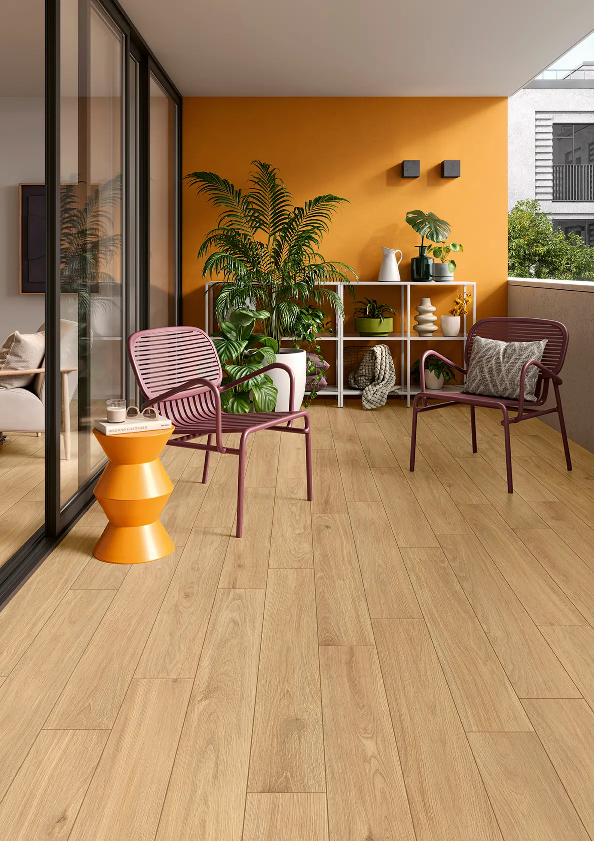 Balcony with wooden floor, two purple chairs, orange side table, and plants against an orange wall.