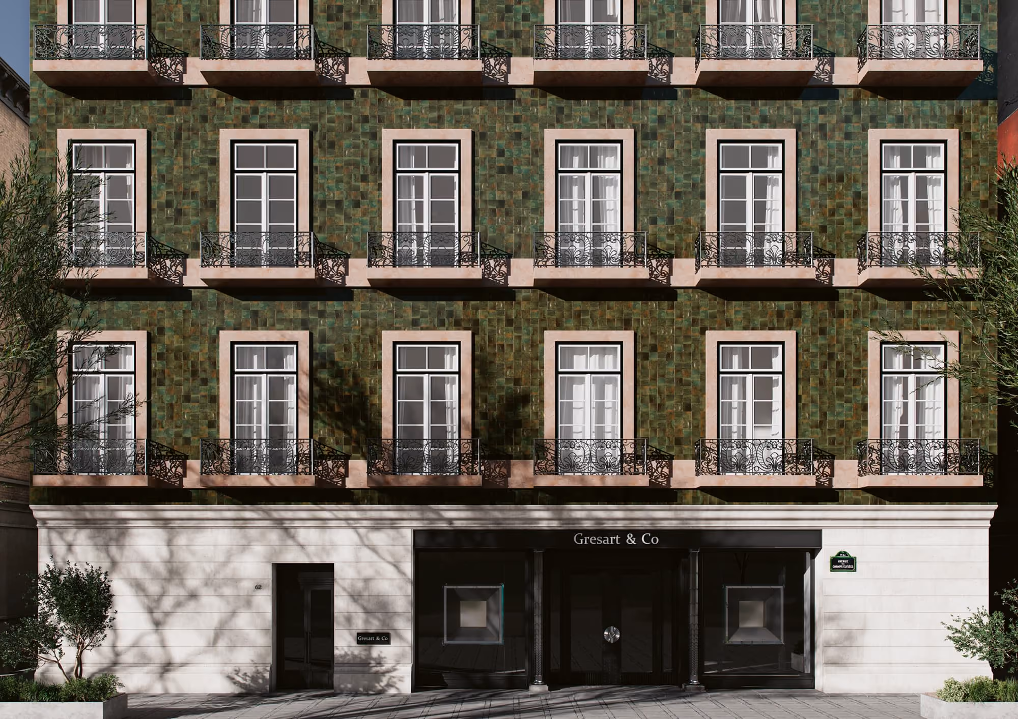 Green-tiled building facade with three rows of windows and black wrought iron balconies above Gresart & Co entrance.