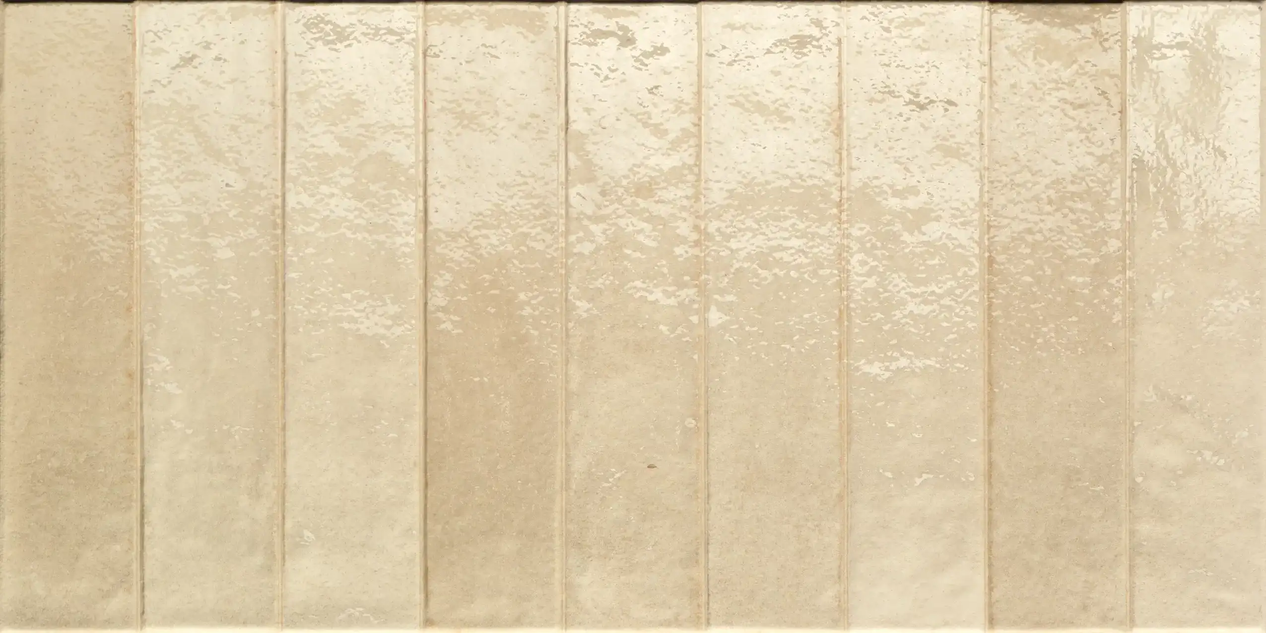 Nine vertical beige ceramic tiles with a glossy, textured finish.