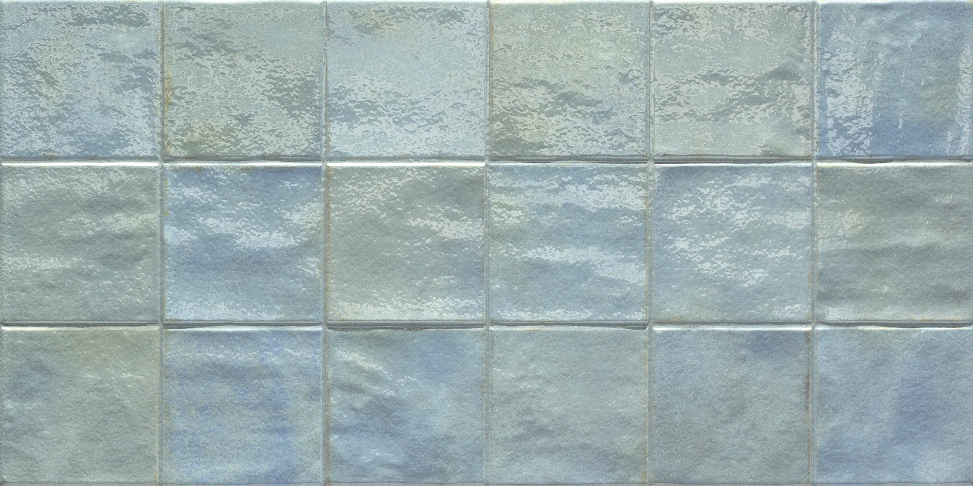 Glossy square ceramic tiles in shades of blue and gray arranged in a grid pattern.