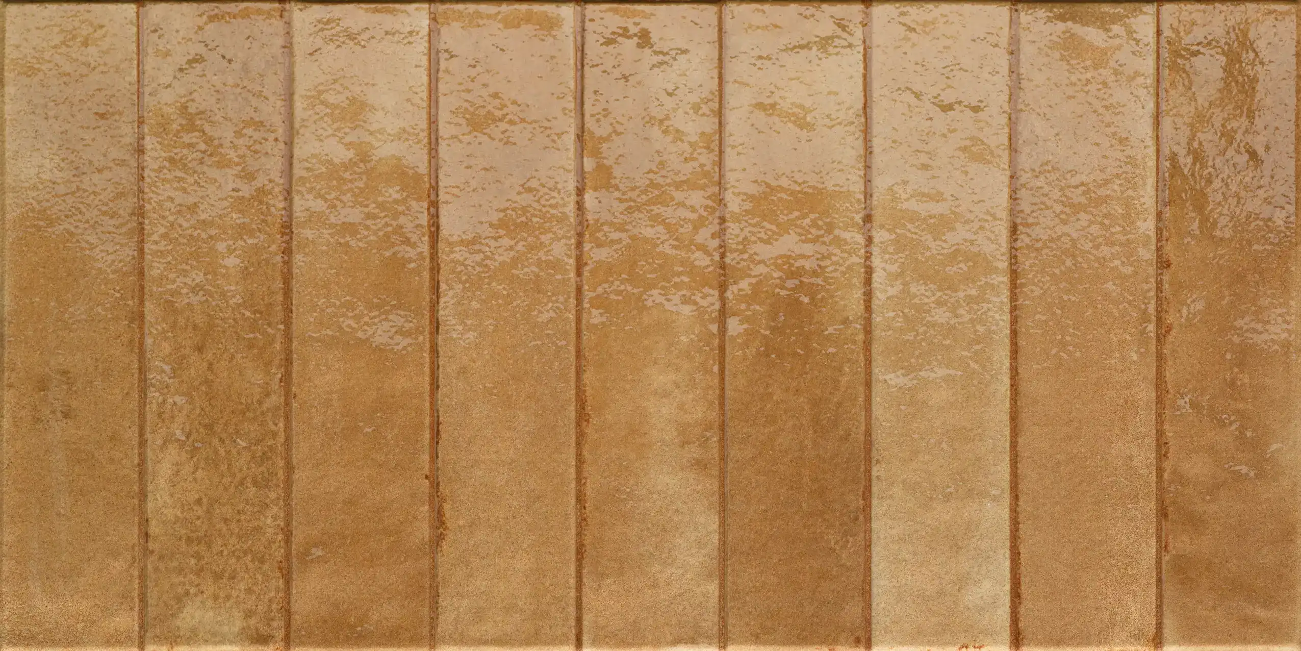 Glossy caramel-colored ceramic rectangular tiles arranged vertically with textured surface.