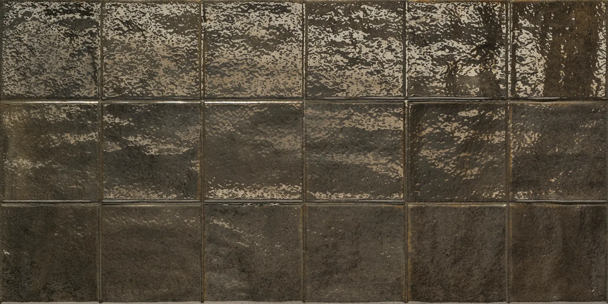 Glossy black ceramic square tiles with textured surfaces arranged in a grid.