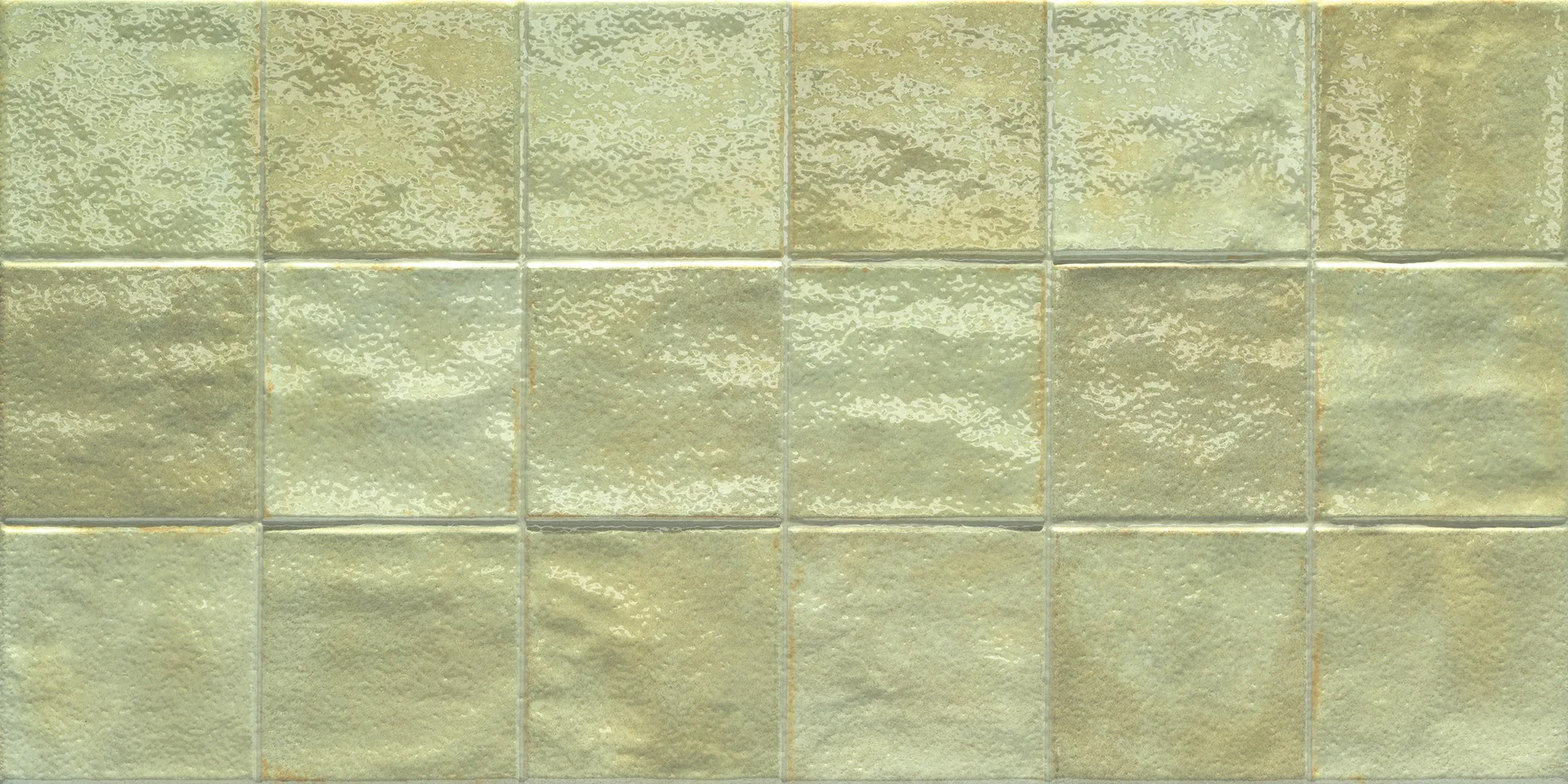 Glossy ceramic tiles in a muted green color arranged in a grid pattern.