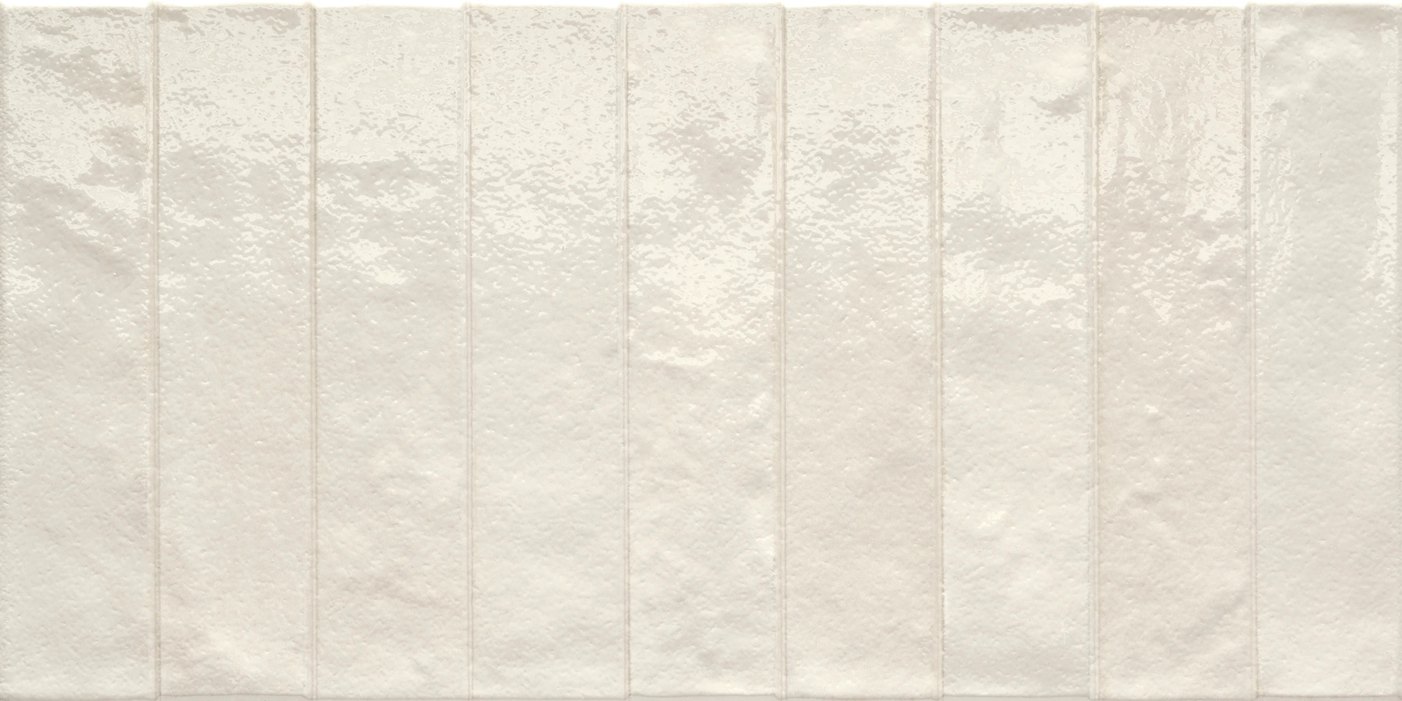 Glossy white rectangular wall tiles with a slightly uneven textured surface arranged in a grid.