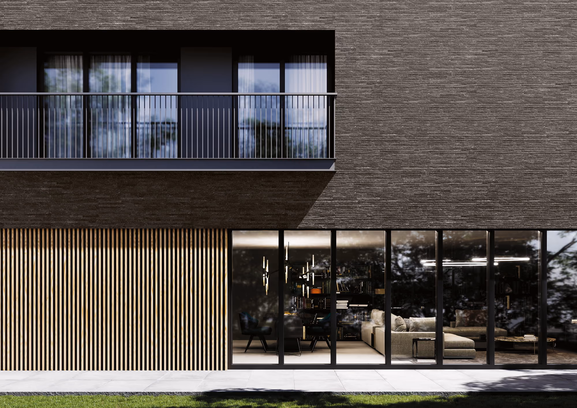 Modern dark brick building facade with balcony above and glass windows showing interior seating and bookshelf.