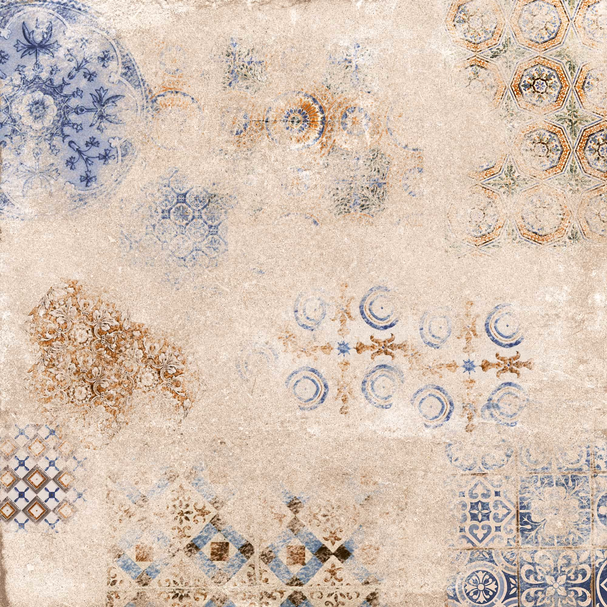 Tile with worn vintage patterns in cream, blue, and brown shades on a textured surface.