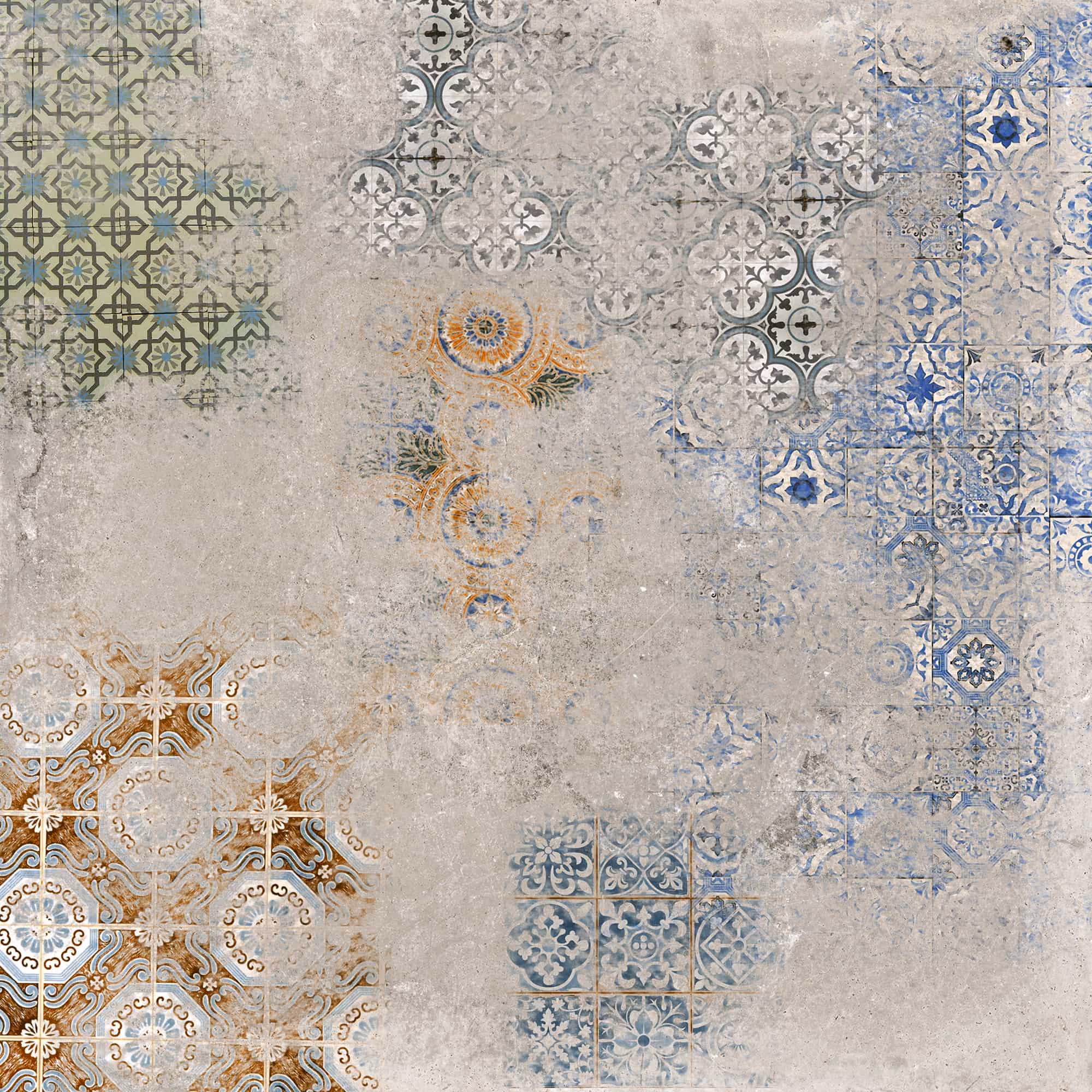 Worn vintage decorative tiles with blue, green, orange, and brown patterns on a textured gray background.