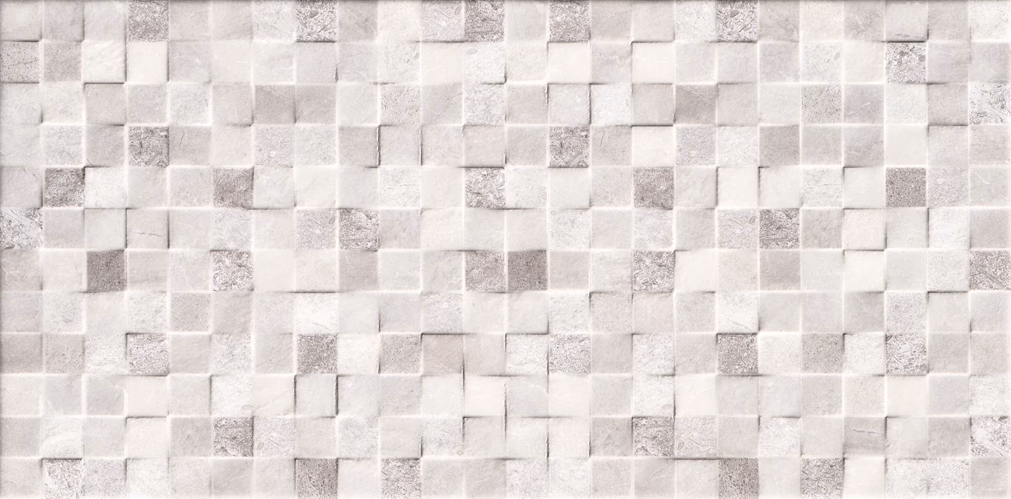 Wall decorated with textured square tiles in various shades of light grey and white.