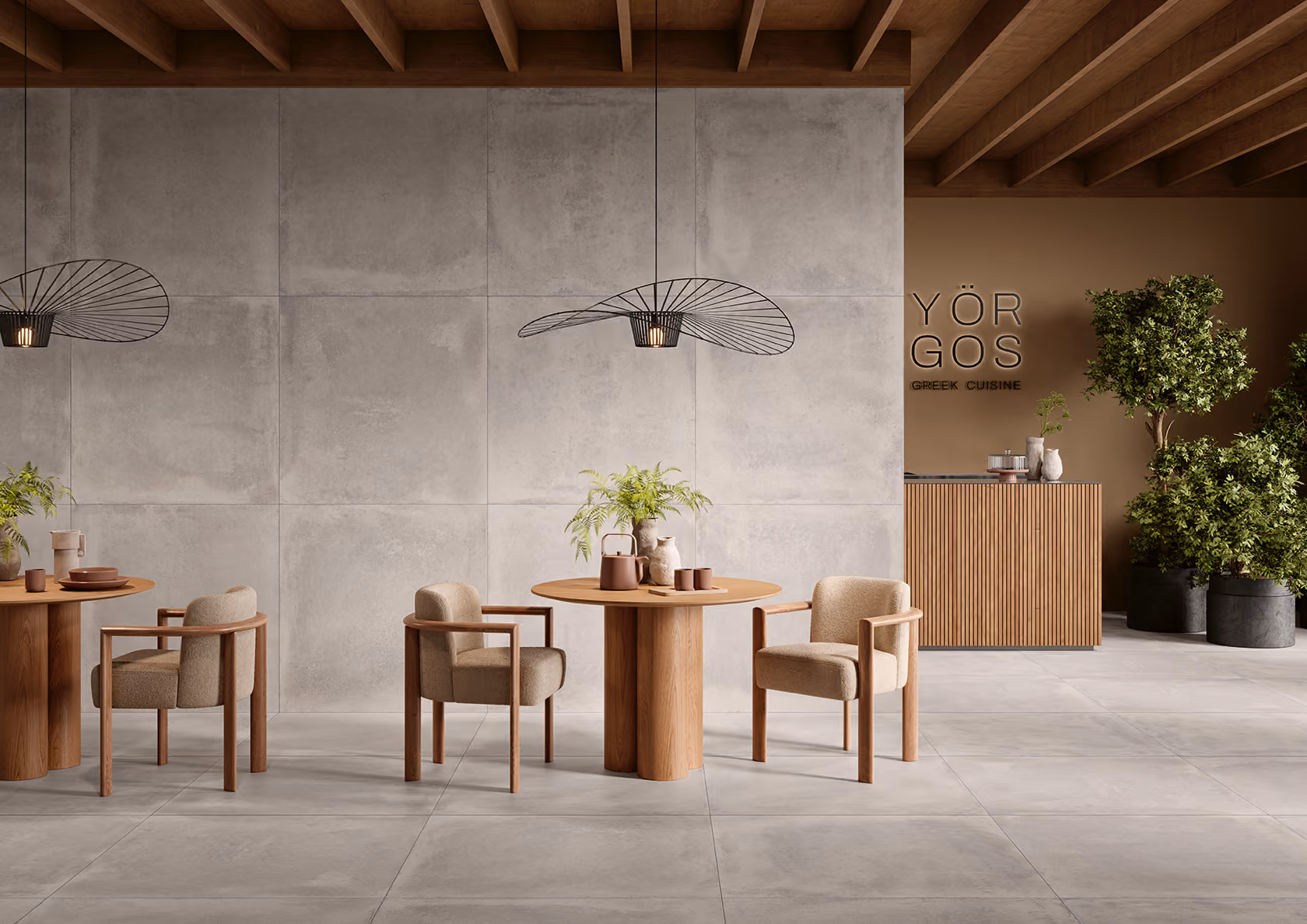 Modern restaurant interior with round wooden tables, beige chairs, pendant lights, and green plants.