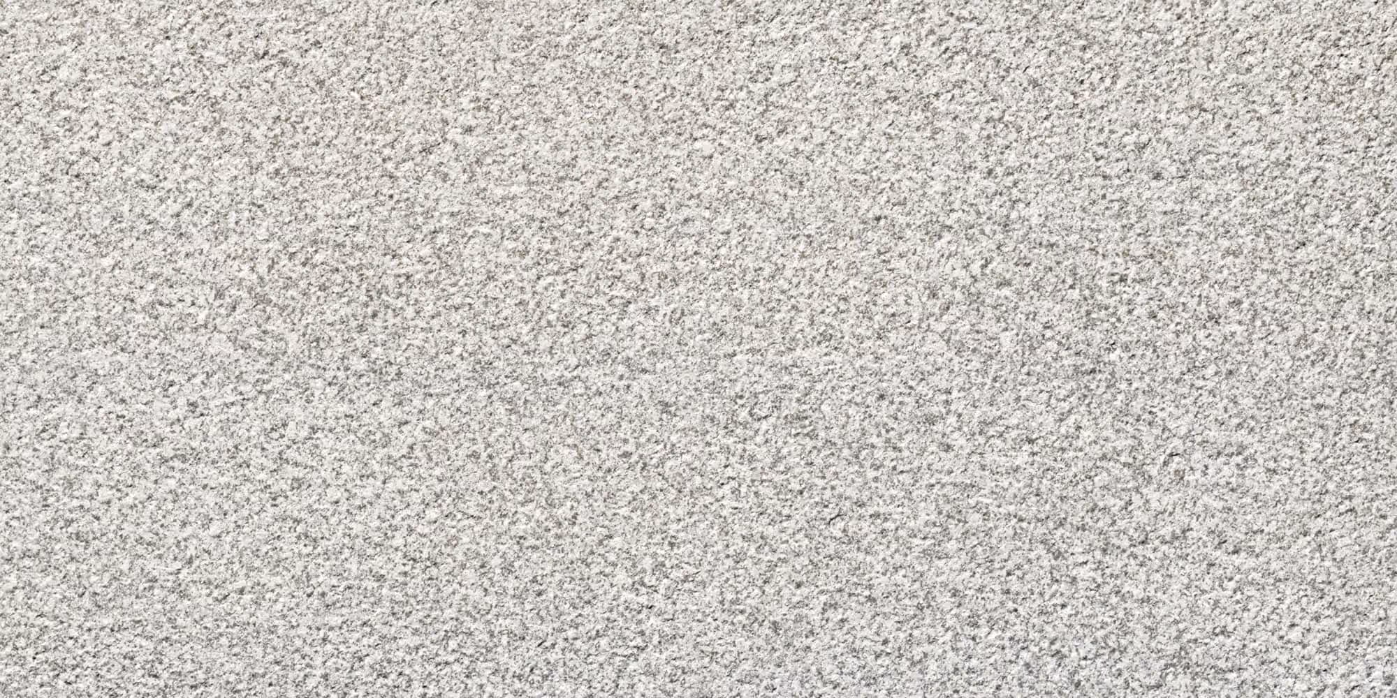 Close-up texture of light gray granite stone surface.