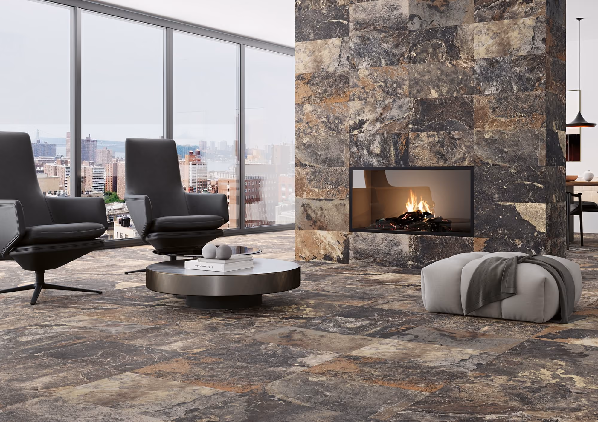 Modern living room with stone tile floor and fireplace, two black chairs, and large windows with city view.