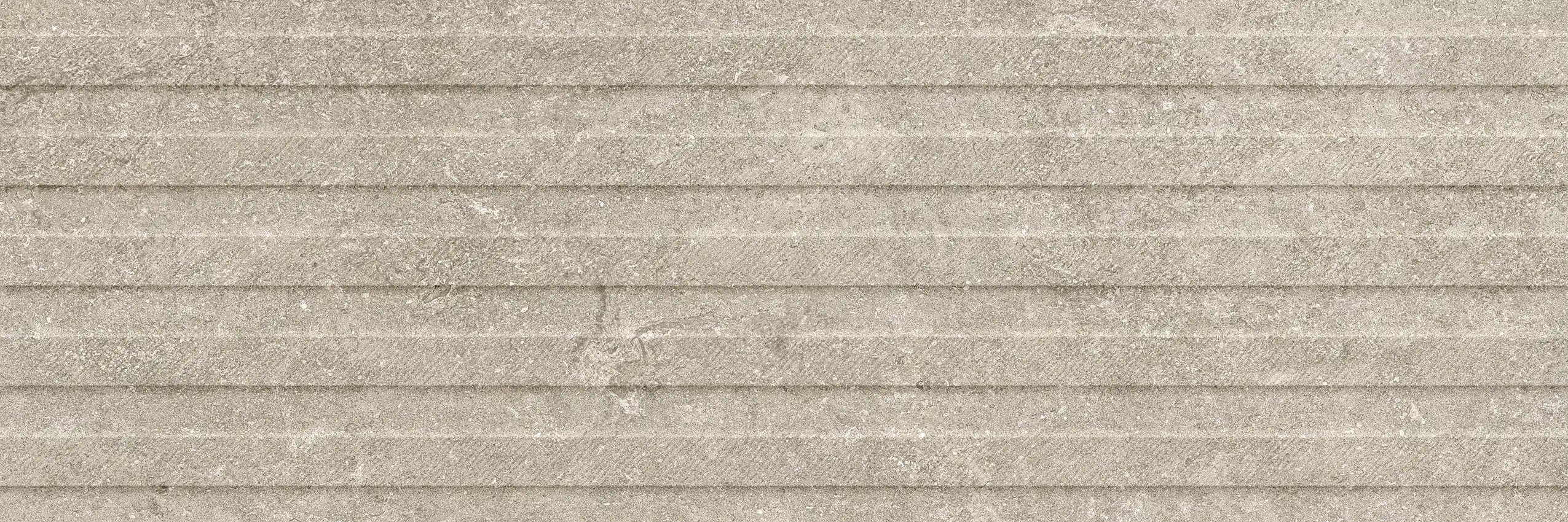 Light grey textured stone surface with horizontal ridged pattern.