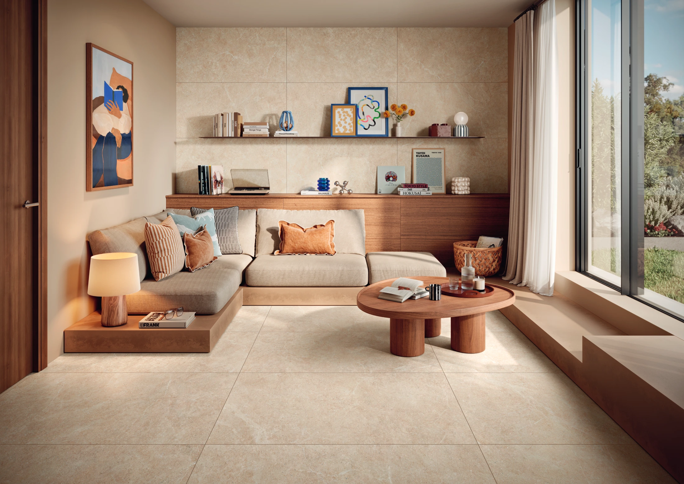 Cozy living room with beige sofa, wooden round table, shelves with books and decor, large window with garden view.