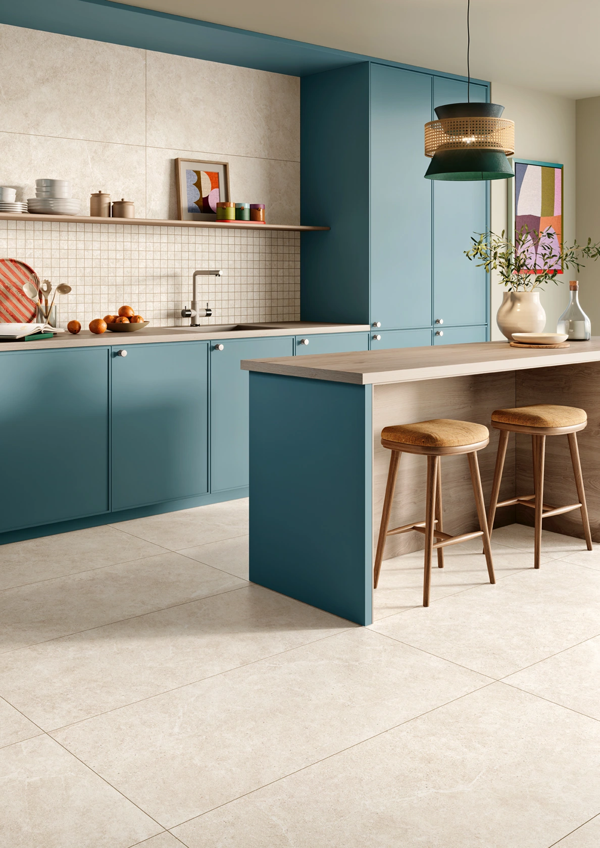 Modern kitchen with teal cabinets, wooden island with stools, pendant light, and artistic decor.