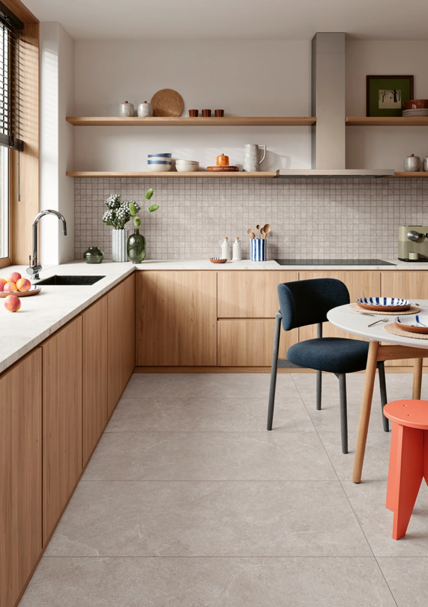 Modern kitchen with wooden cabinets, white countertops, tiled backsplash, and a dining table with chairs.