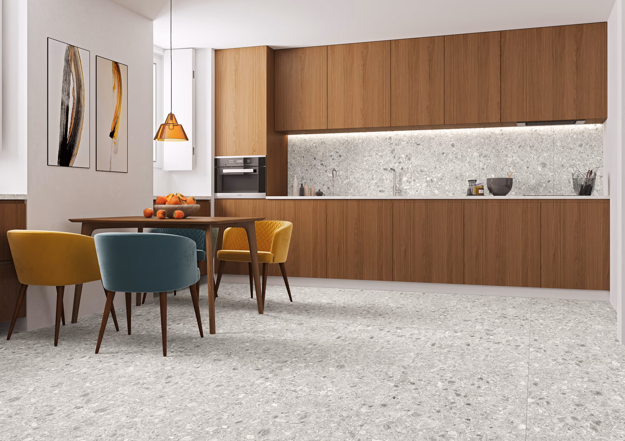 Modern kitchen with wooden cabinets, terrazzo floor and backsplash, and a dining table with colorful chairs.