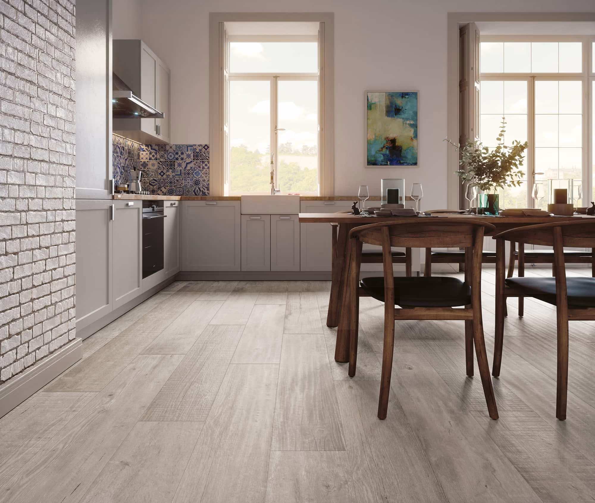 Bright kitchen with light wood flooring, gray cabinets, blue tile backsplash, and wooden dining table.