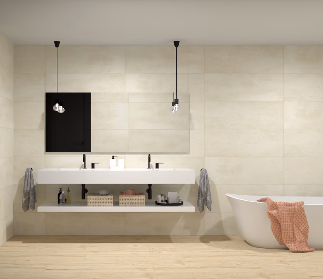 Modern bathroom with two sinks, black fixtures, hanging lights, large mirror, and a bathtub with a pink towel.