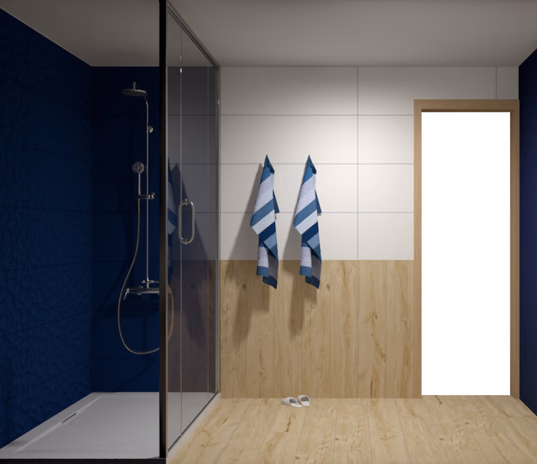 Modern bathroom with glass shower, blue and white towels hanging on tiled wall, and slippers on wooden floor.