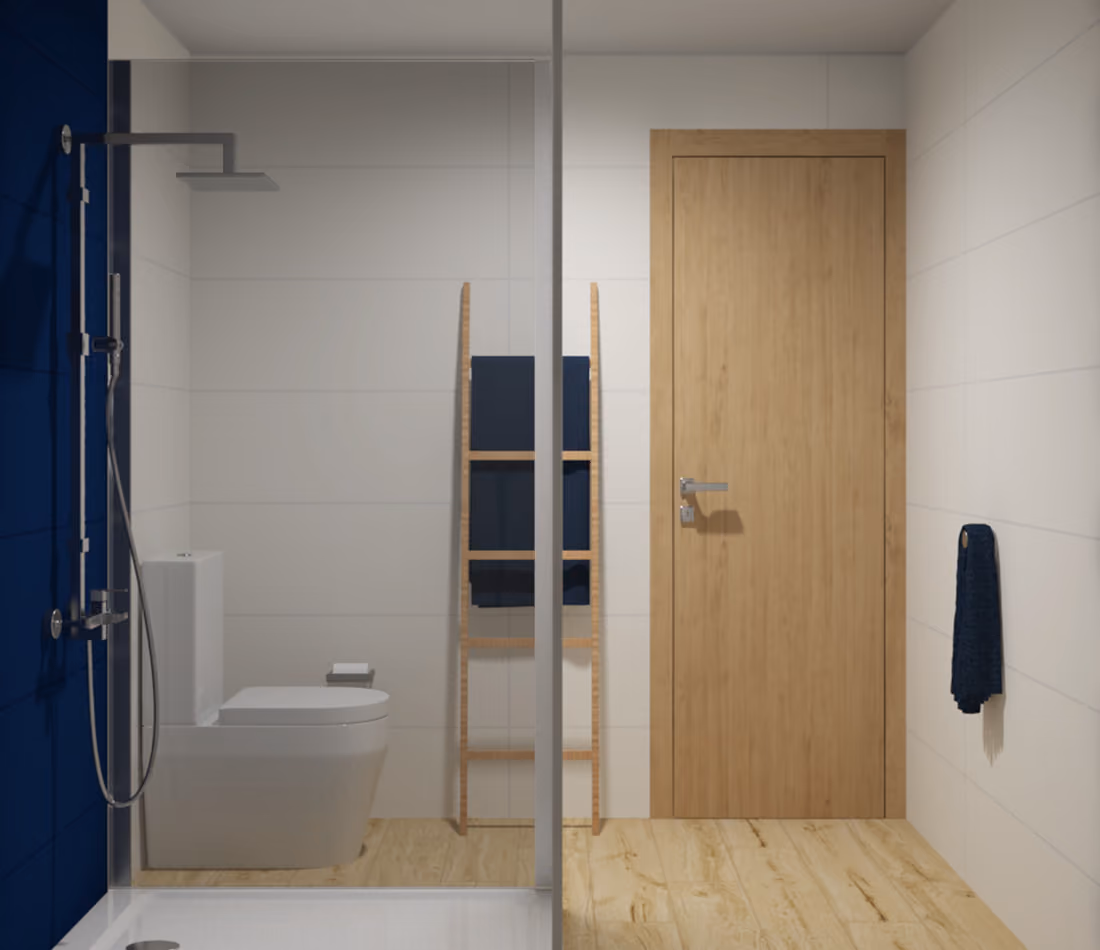 Minimalist bathroom with wooden door, white toilet, glass shower, ladder towel rack, and navy towels.