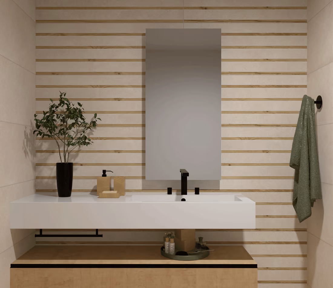 Modern bathroom sink with black faucet, green towel, plant in black vase, and wooden slat wall background.