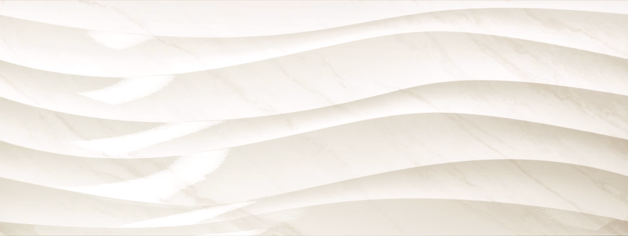 White marble surface with soft, wavy patterns creating a flowing design.