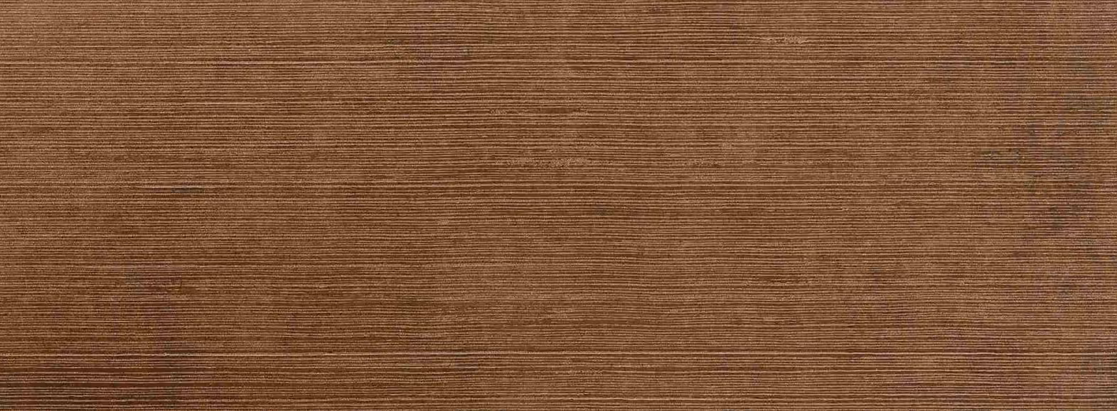 Close-up of textured brown surface with fine horizontal lines and subtle color variations.