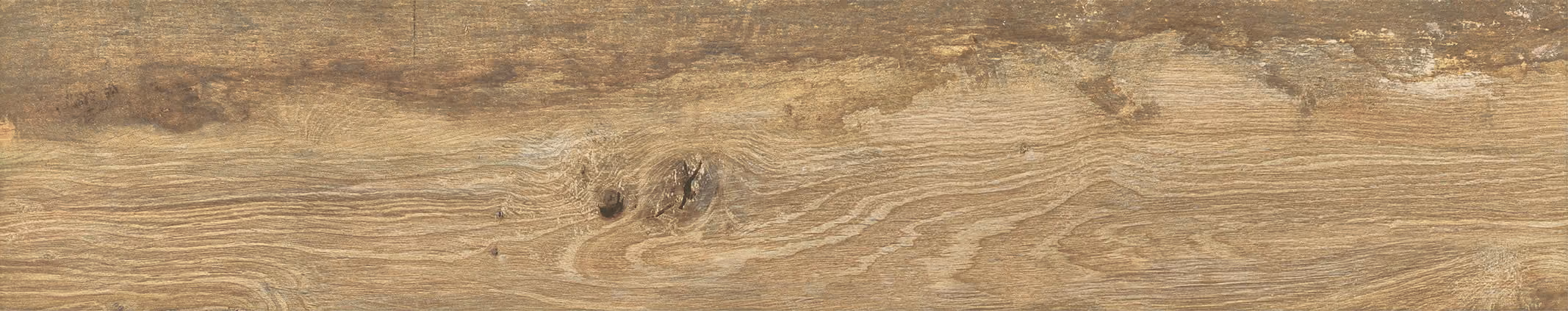 Close-up of natural wood grain texture with knots on a beige wooden surface.