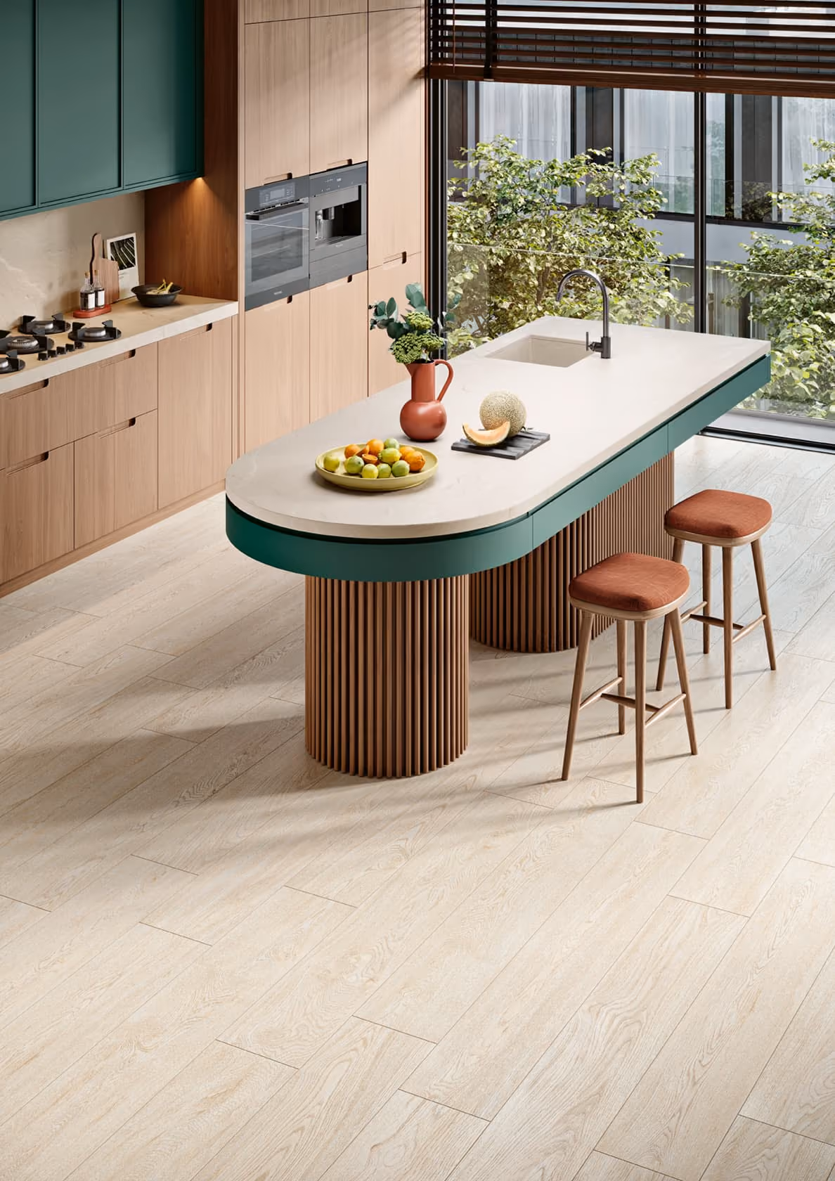 Modern kitchen with wood cabinets, green island with sink, fruits, plants, and two brown stools.