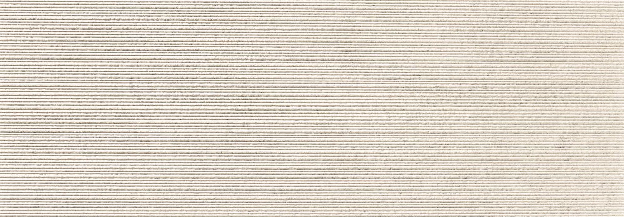 Horizontal close-up of textured gray fabric with tightly ribbed pattern.