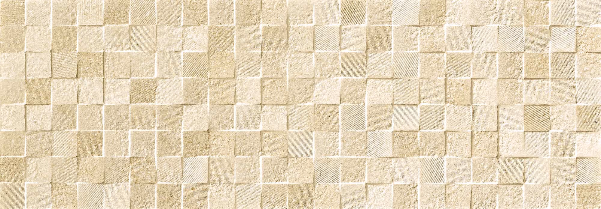 Wall of small beige square tiles with varied textures arranged in a grid pattern.