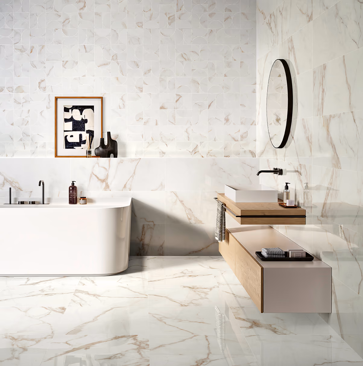 Modern bathroom with white marble tiles, a standalone tub, floating wood vanity, and round mirror.
