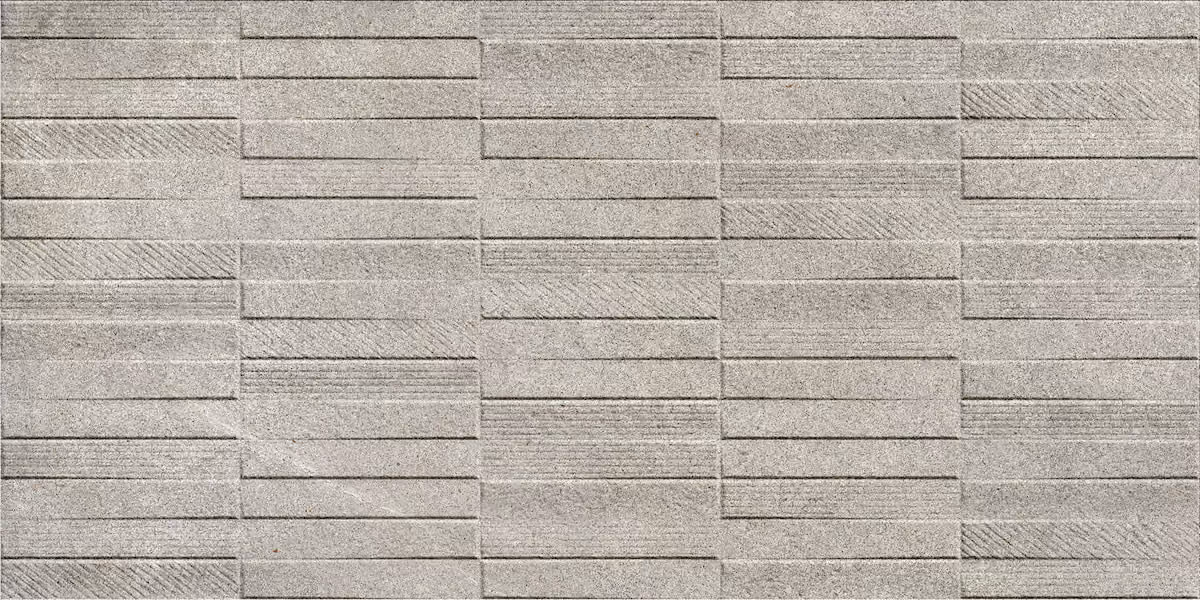 Gray textured wall with rectangular blocks arranged in a staggered pattern.