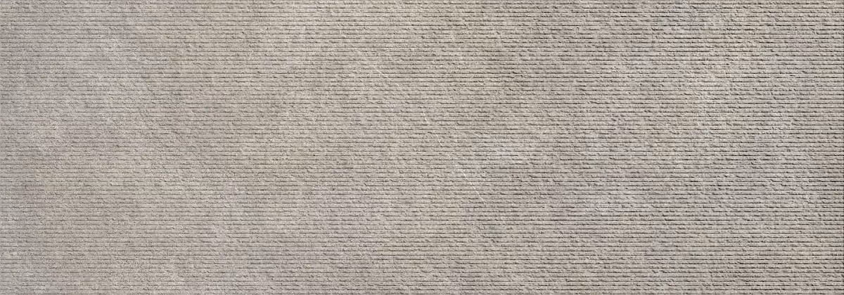 Close-up of a gray textured surface with horizontal ridges and subtle scratches.
