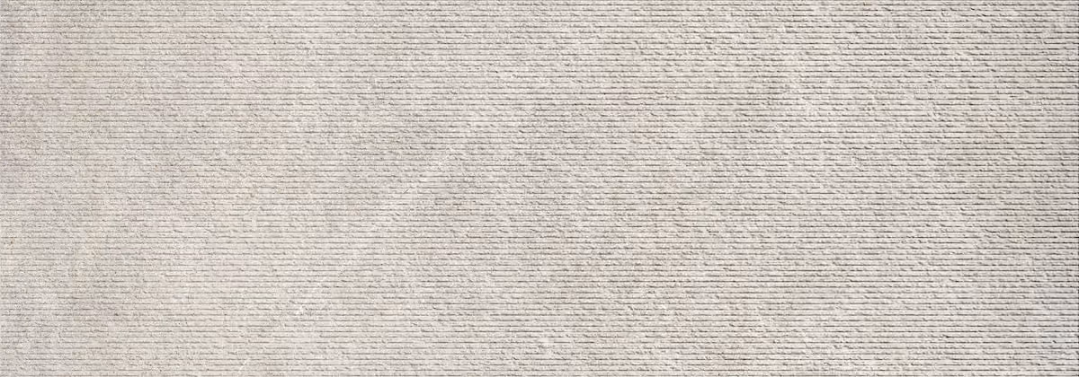 Close-up of a textured light grey surface with fine horizontal lines.