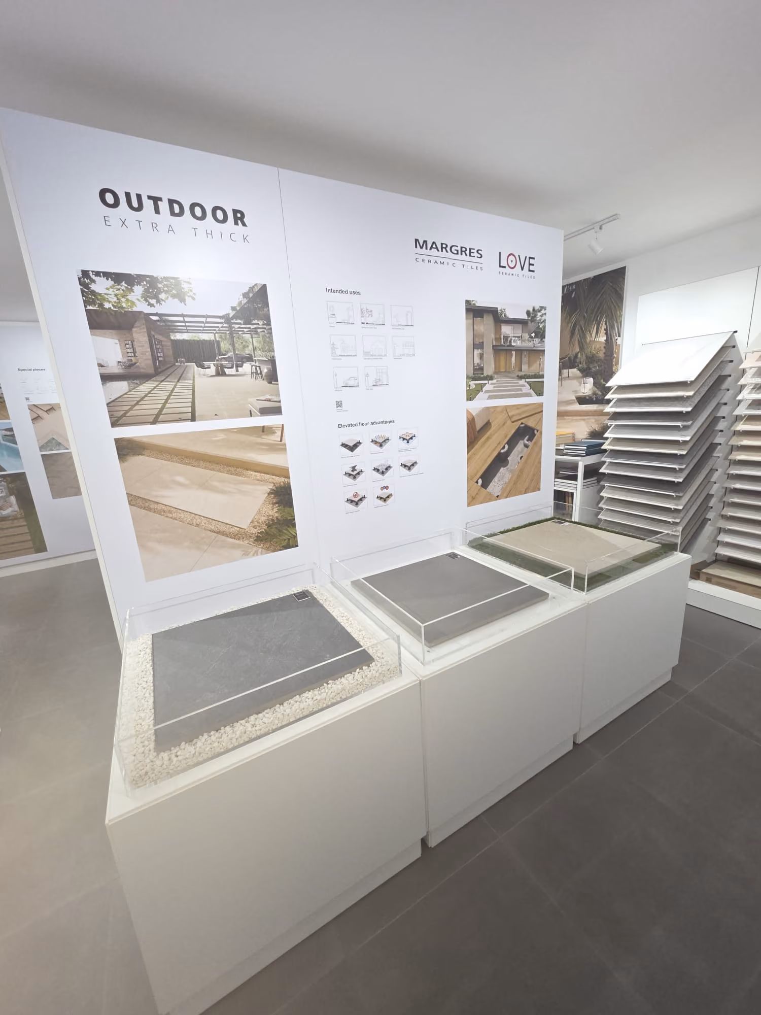 Showroom display of outdoor extra thick ceramic tiles by Margres and Love with sample tiles in cases.